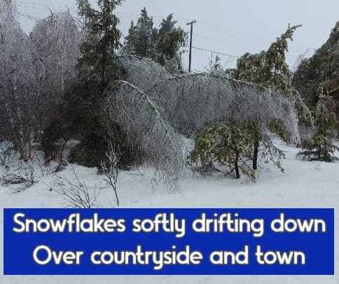 Snowflakes softly drifting down Over countryside and town